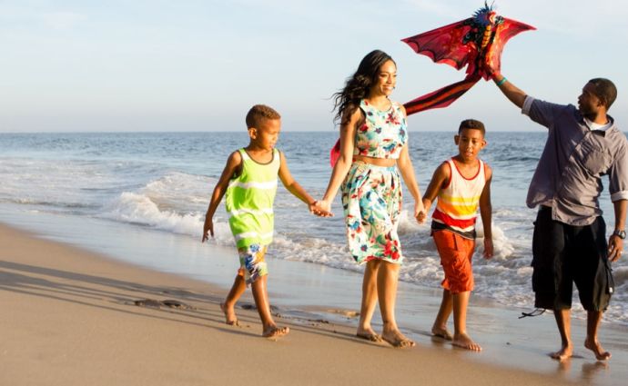 Family walking down the beach in Los Angeles