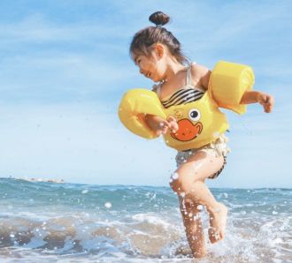 girl playing on a beach