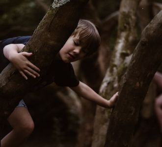 kids play in the woods