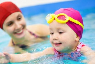 Mom and daughter swimming