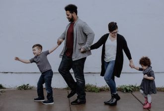 a family walking down the street