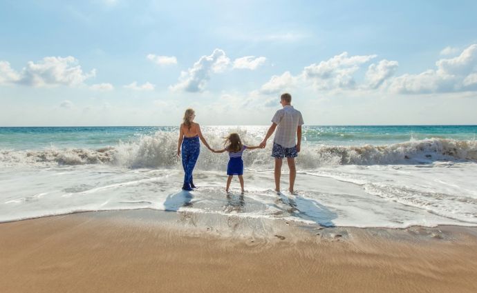 Family on beach near water