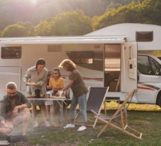Family outside an RV