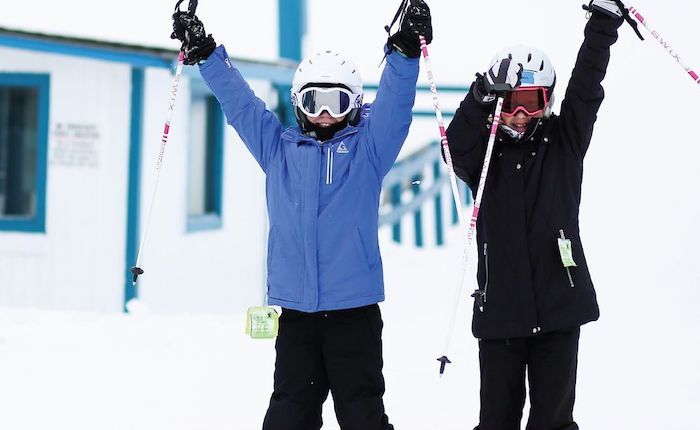 powder ridge two skiing girls