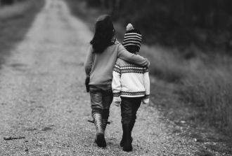 sister cheers up unhappy brother