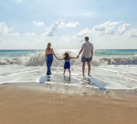 a family on a beach on holiday