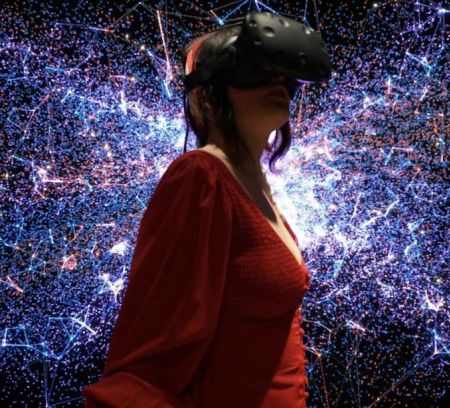 Woman in a red dress exploring a VR museum