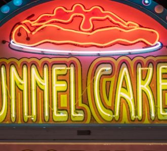 A close up of a funnel cakes sign