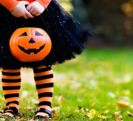 halloween, blog, halloween for kids, girl holding pumpkin at Halloween