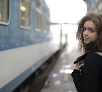 Female student about to board train
