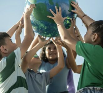 kids holding a globe