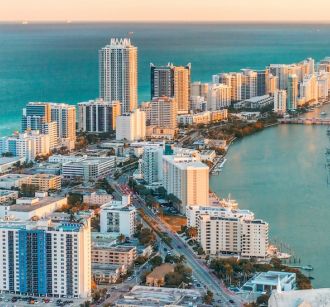 miami, florida, skyline over Miami at sunset with water and buildings