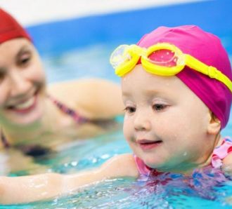 Mom and daughter swimming