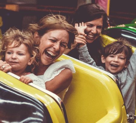 a family with young children on a rollercoaster