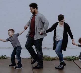 a family walking down the street