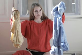 a woman sorts washing