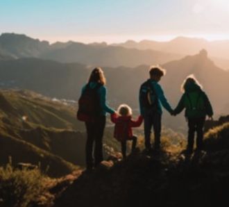 Mother with kids travel in mountains hiking