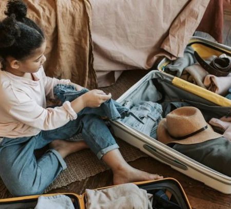 Young girl packs bags