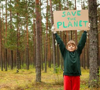 Kid with Save The Planet sign